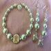 E2
White pearls and silver beads with heart charm